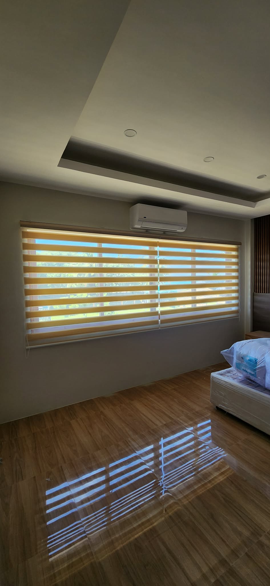 Warm beige Korean combi zebra blinds in a modern bedroom, adjustable light control