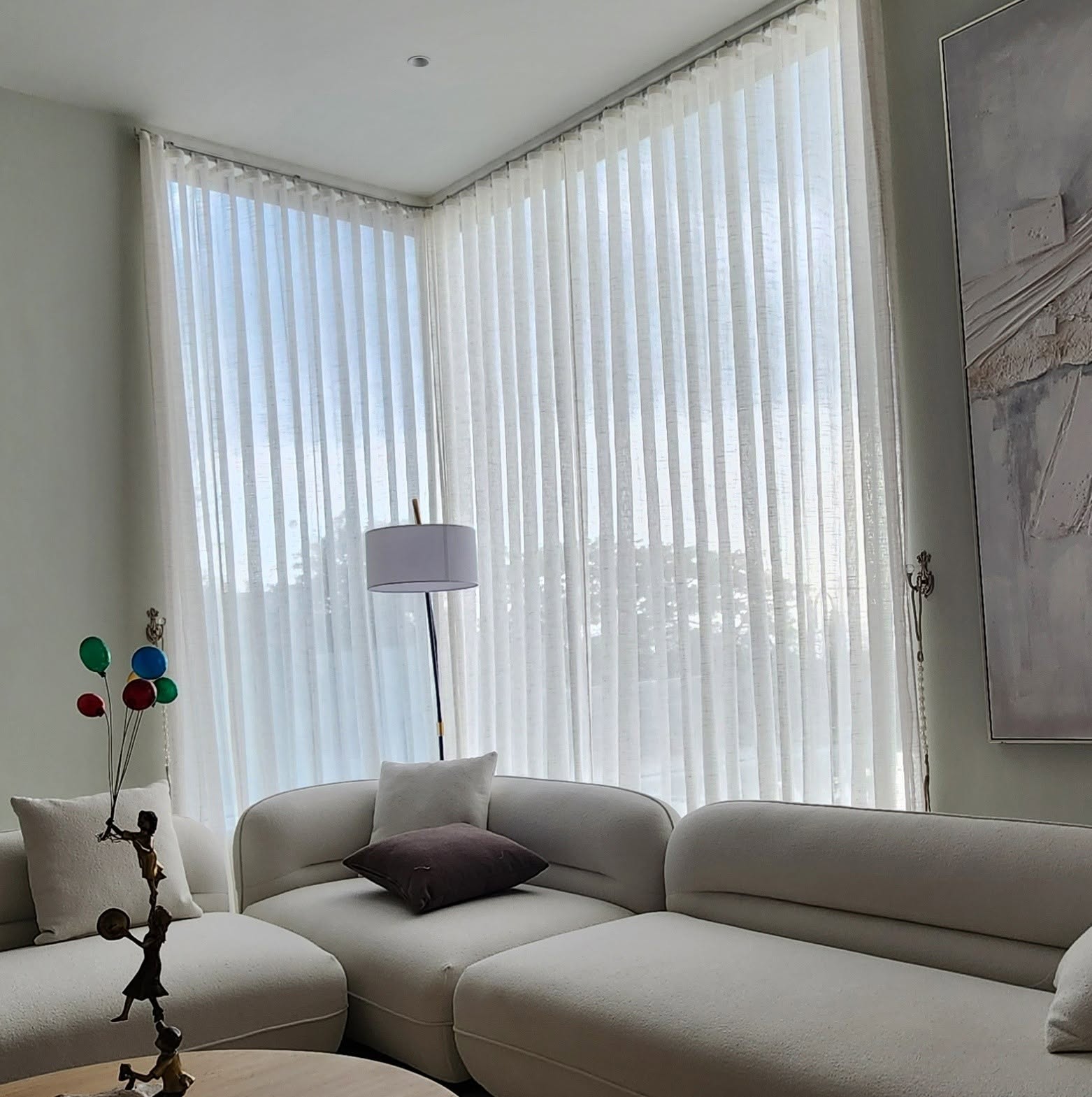 Corner window installation of white Korean vertical sheer blinds in modern living room
