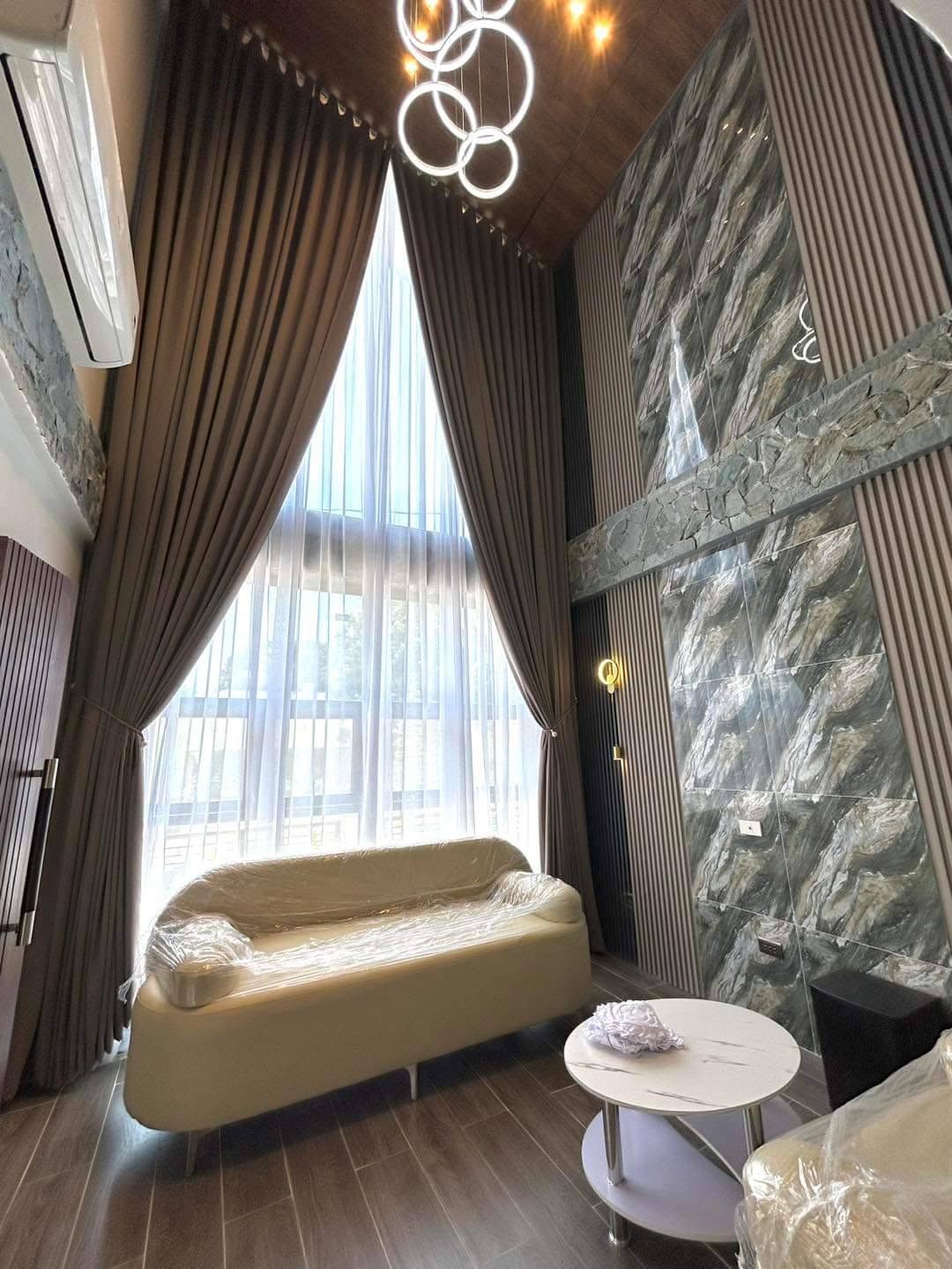 Close-up of tailored curtain pleats in a sunlit room